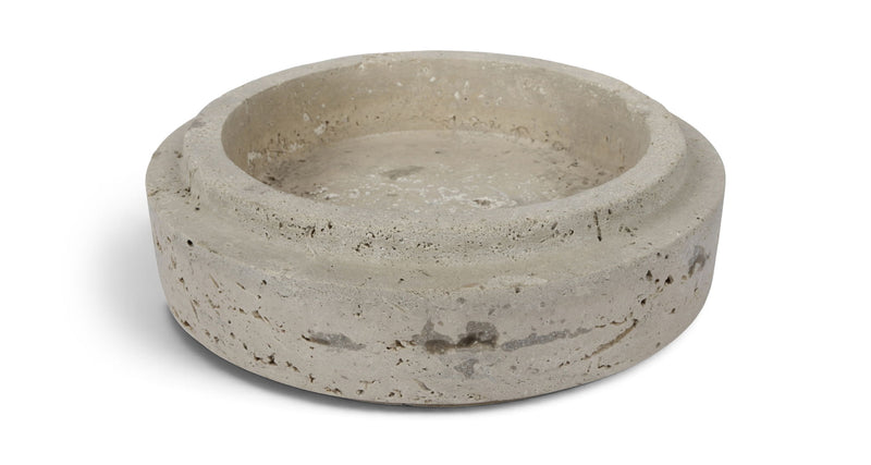 Light gray travertine bowl with shallow round basin and natural speckling