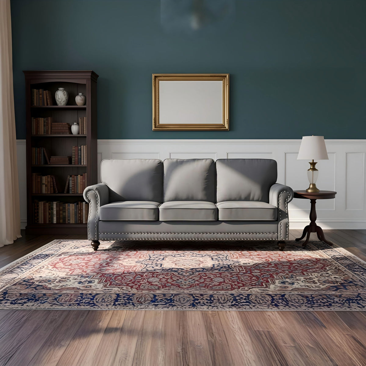 Gray 3-seat sofa with nailhead trim, rolled arms, and turned legs
