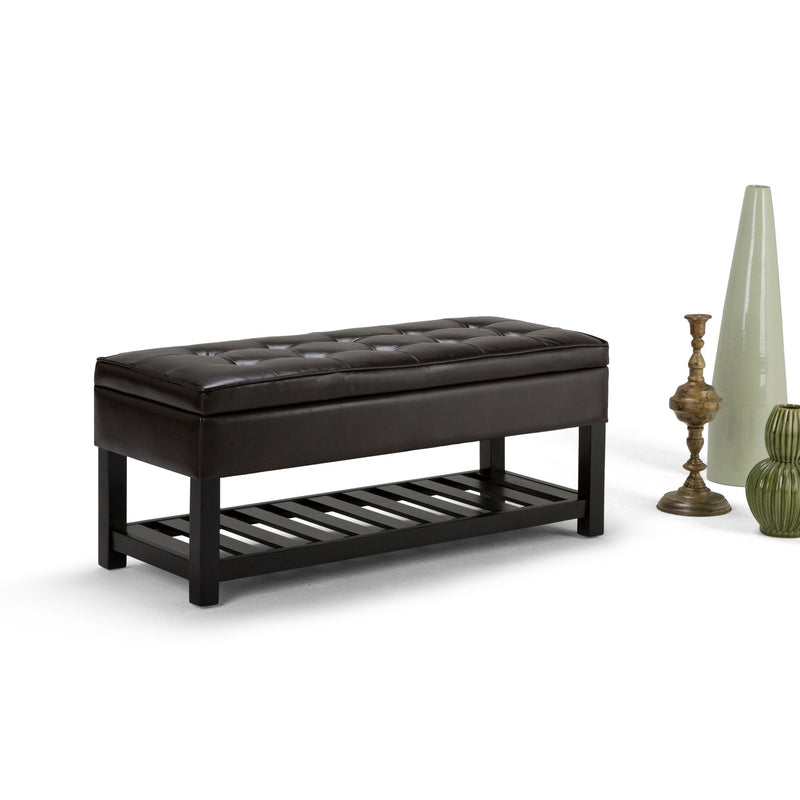 Dark brown storage ottoman bench with padded tufted lid and open slat base