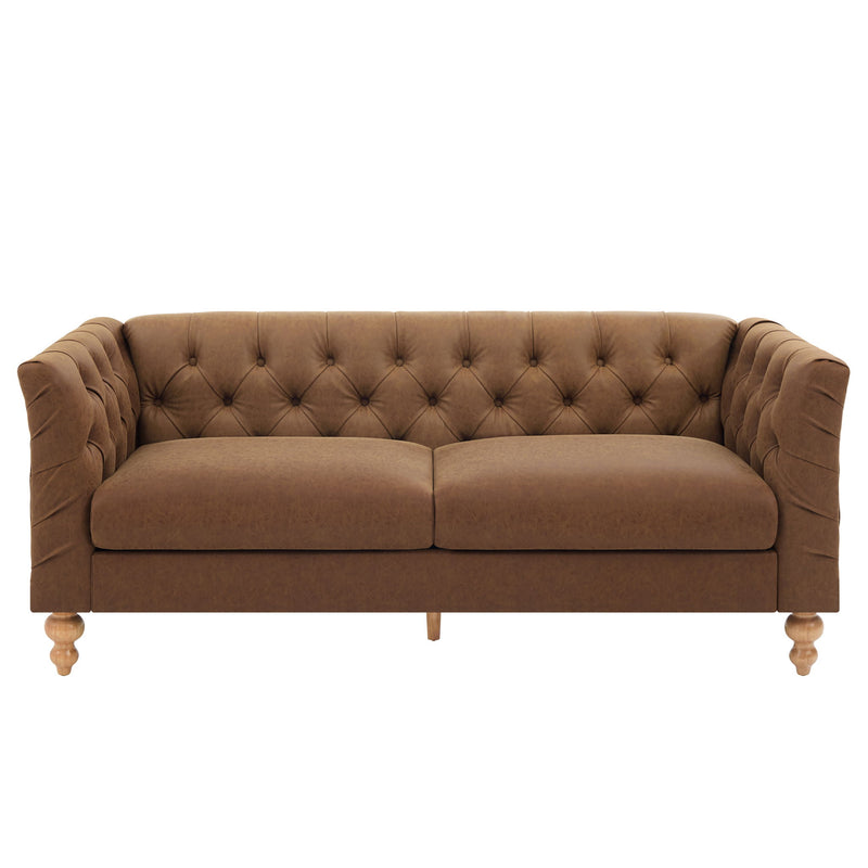 Light brown chesterfield-style sofa with tufted back, flared arms, and wooden legs