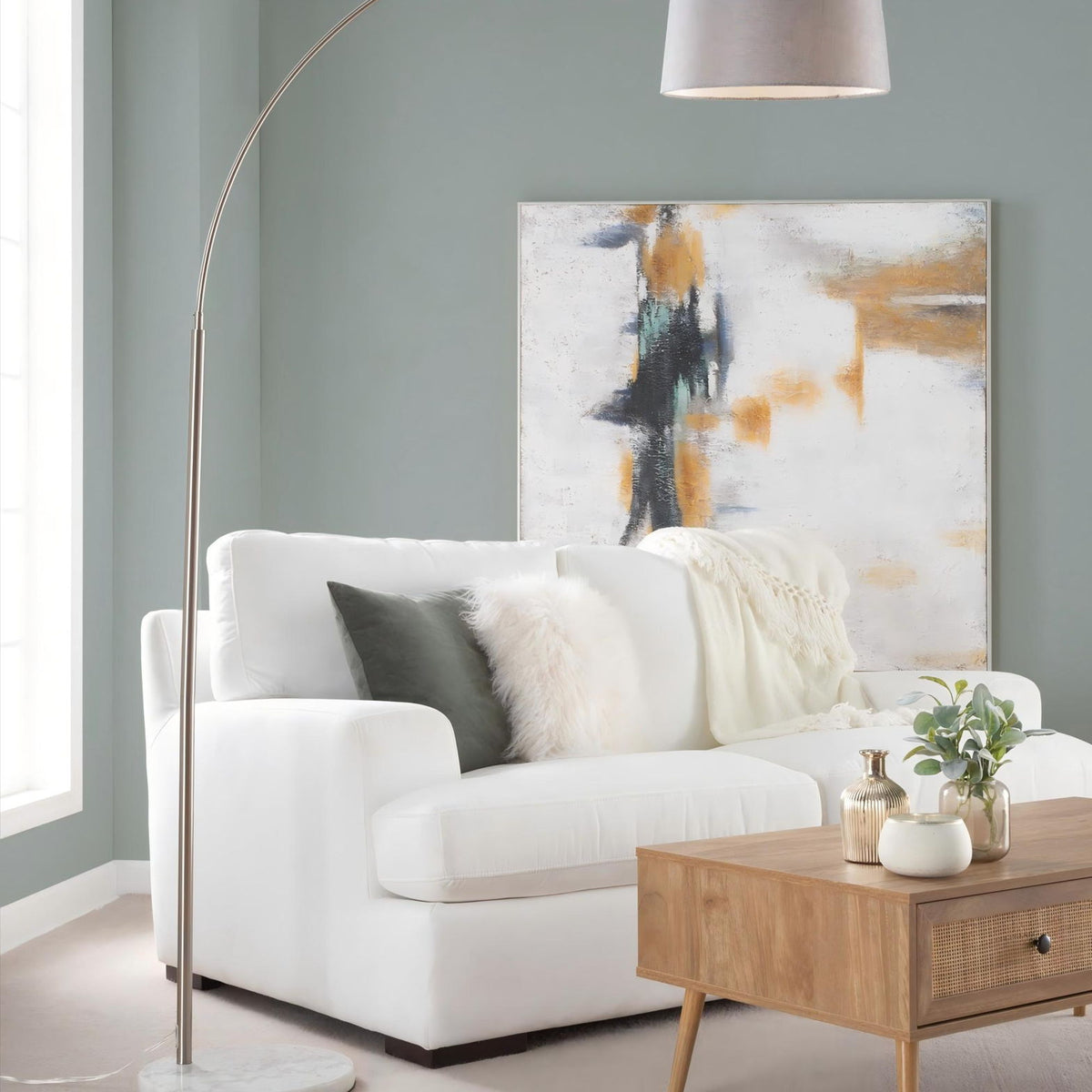 Gray fabric shade contemporary floor lamp with arched metal stem and round stone base