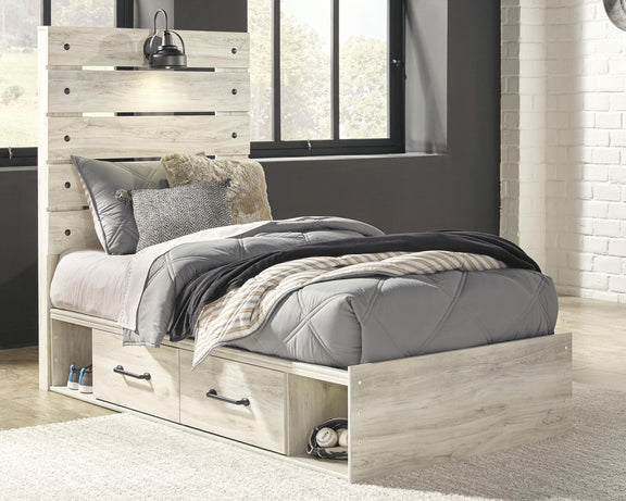 Cambeck panel bed with light wood frame, two front drawers, and upholstered bed linens