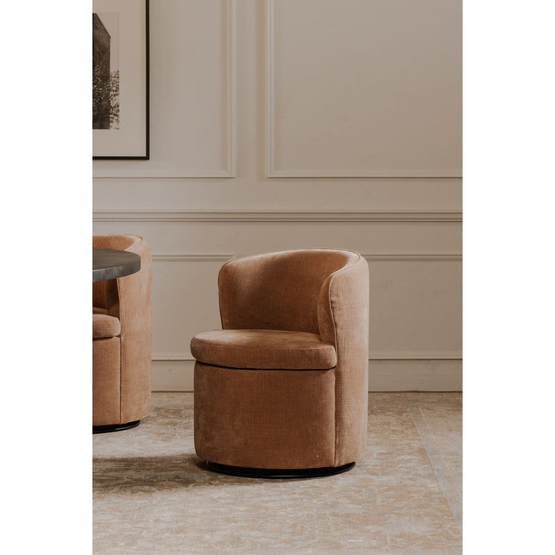 Dusty pink upholstered swivel accent chair with rounded backrest and curved arms