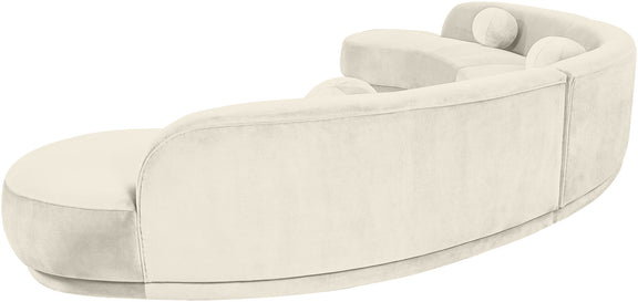 White velvet upholstered sectional chaise with curved back and rounded armrests