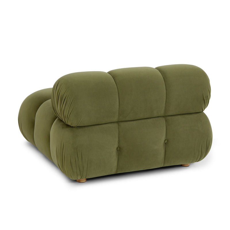 Olive green modular corner chair side view with rounded back and tufted panels.