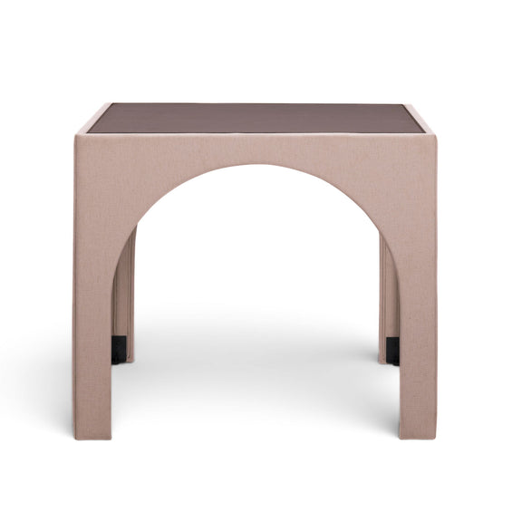 Light pink fabric game table with rounded arch cutouts and dark tabletop