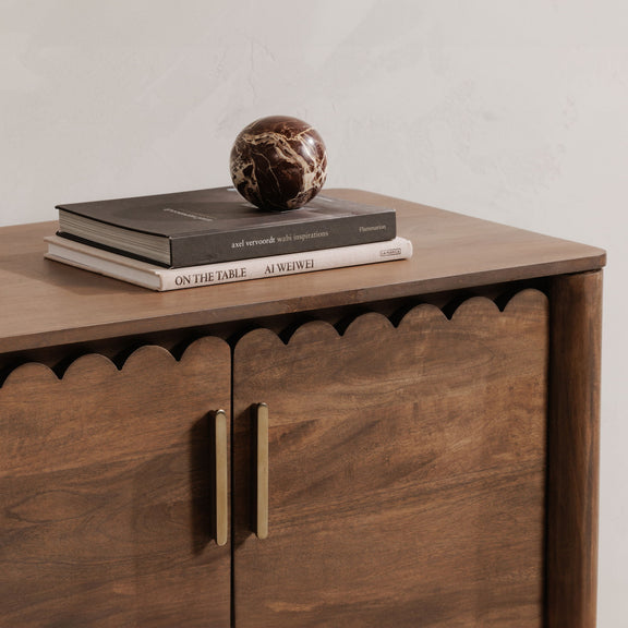 Vintage brown sideboard corner with two doors and vertical metal bar handles