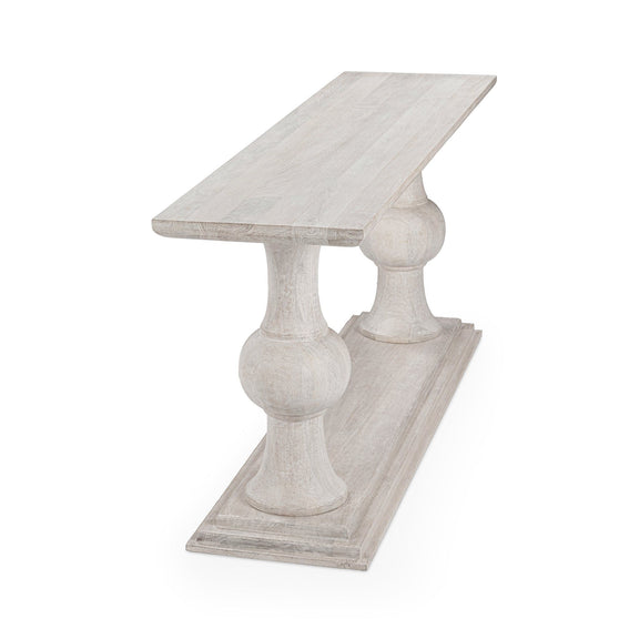 Creamwood console table with rounded pedestal supports and lower shelf, light distressed look.