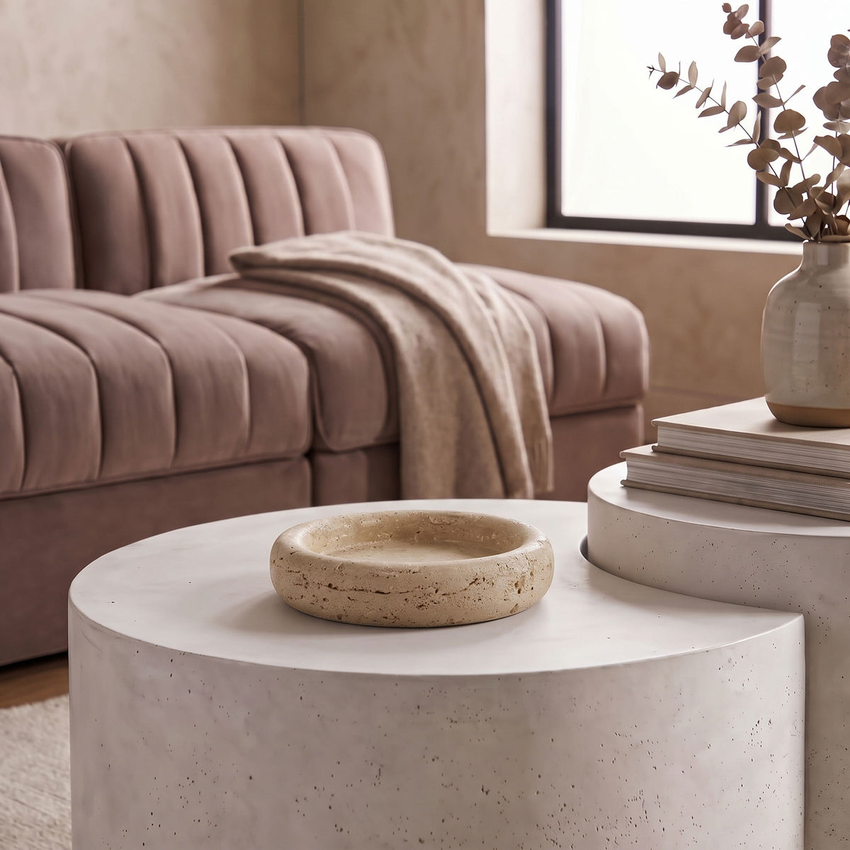 Beige genuine travertine tray with shallow round bowl and rough, natural veining.