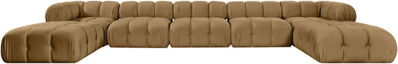 Light brown modular sectional sofa with padded tufted seats and rounded ottoman sections