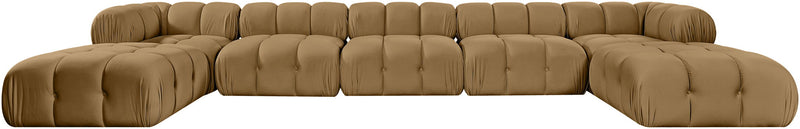 Light brown modular sectional sofa with padded tufted seats and rounded ottoman sections