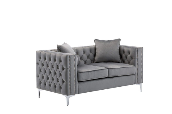 Gray tufted loveseat with two seat cushions, decorative nailhead trim, thin legs