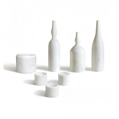 White marble decor set with bottles and round candle holders, 7-piece arrangement