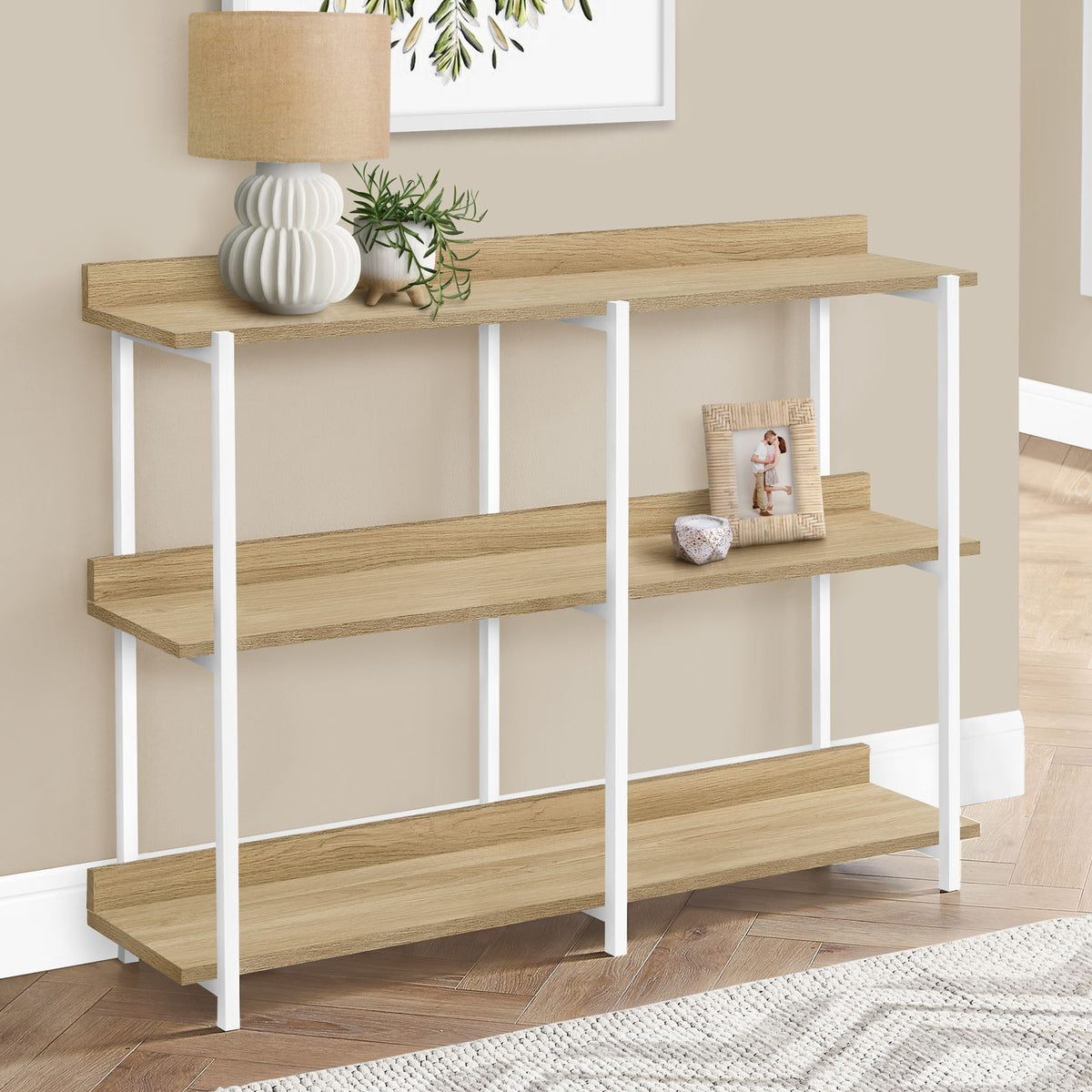 Light brown 3-tier console table with open shelves and white metal frame