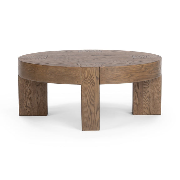 Round coffee table with smooth round top and block legs, cafe brown wood