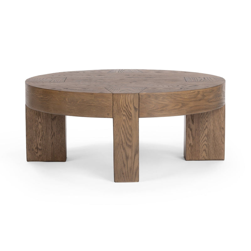 Round coffee table with smooth round top and block legs, cafe brown wood