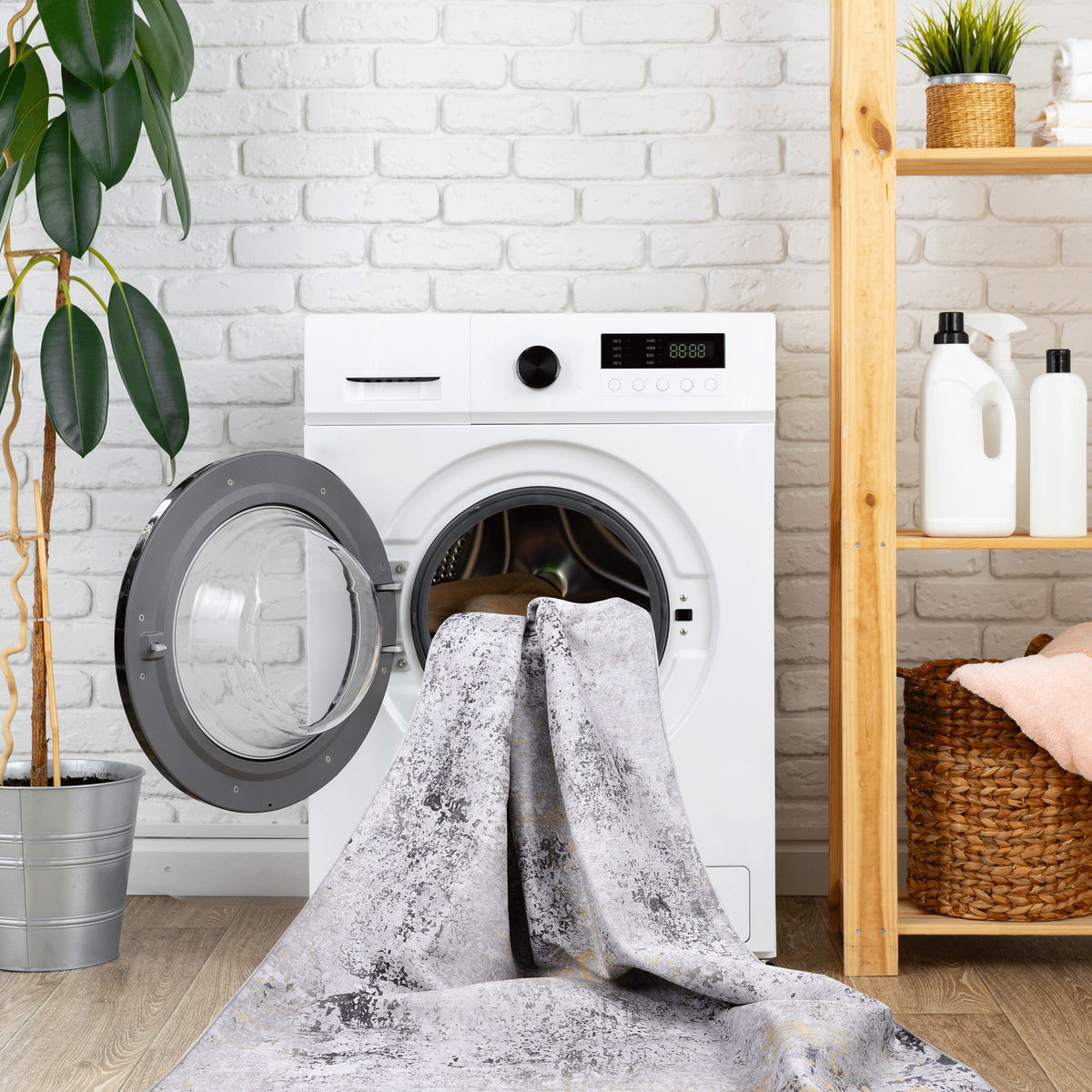 Washable gray runner rug with distressed white speckles, long and narrow, in laundry.