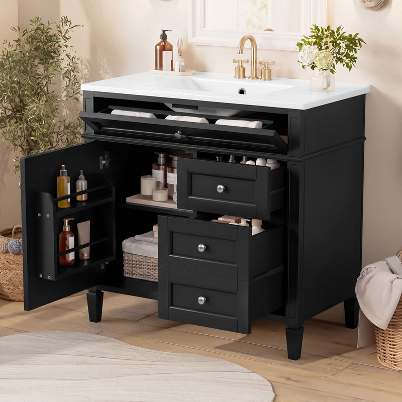 Black vanity opened to show tip-out drawer, cabinet shelves and three pull-out drawers