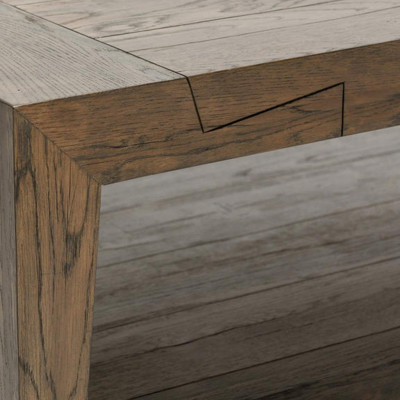 Close-up of dark wood coffee table frame with visible grain and corner joinery