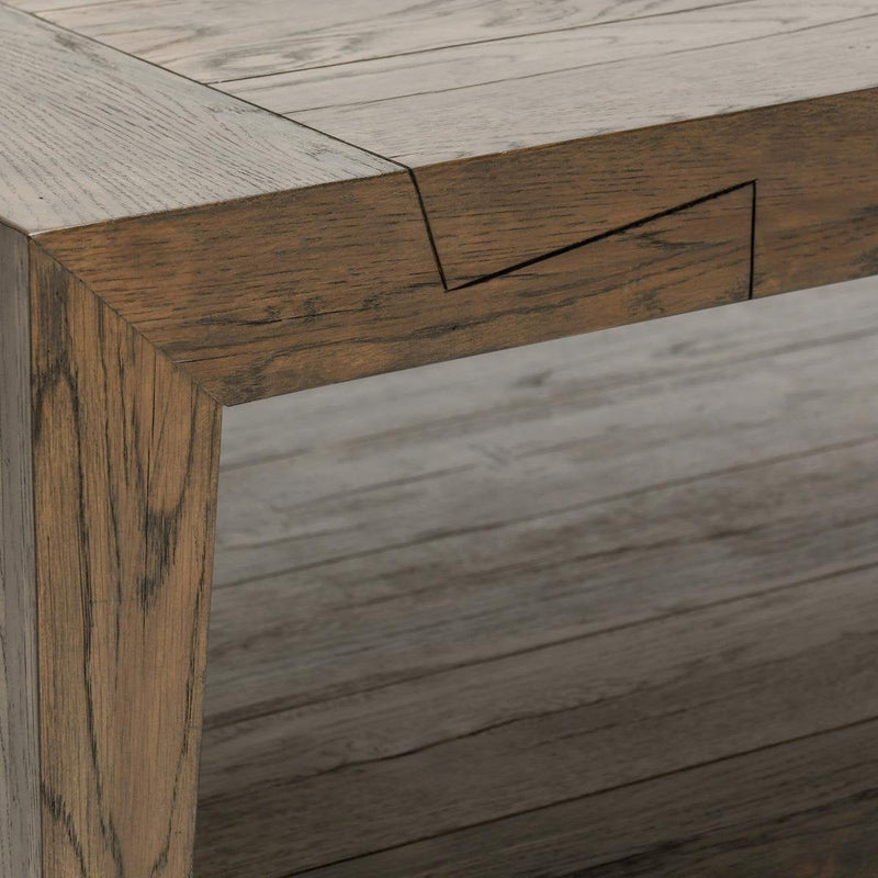 Close-up of dark wood coffee table frame with visible grain and corner joinery