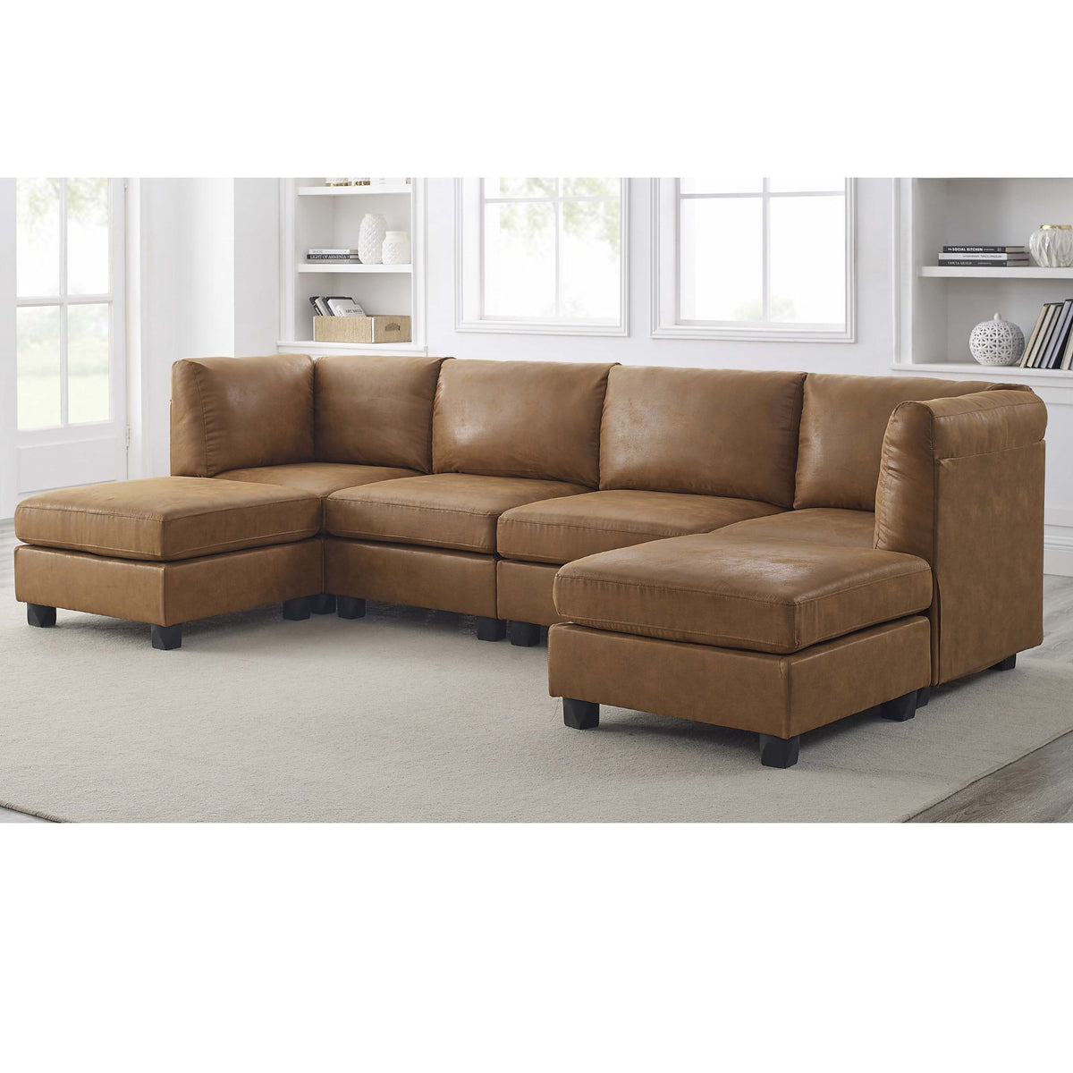 Brown sectional sofa with right ottoman chaise, tufted cushions, and dark legs.