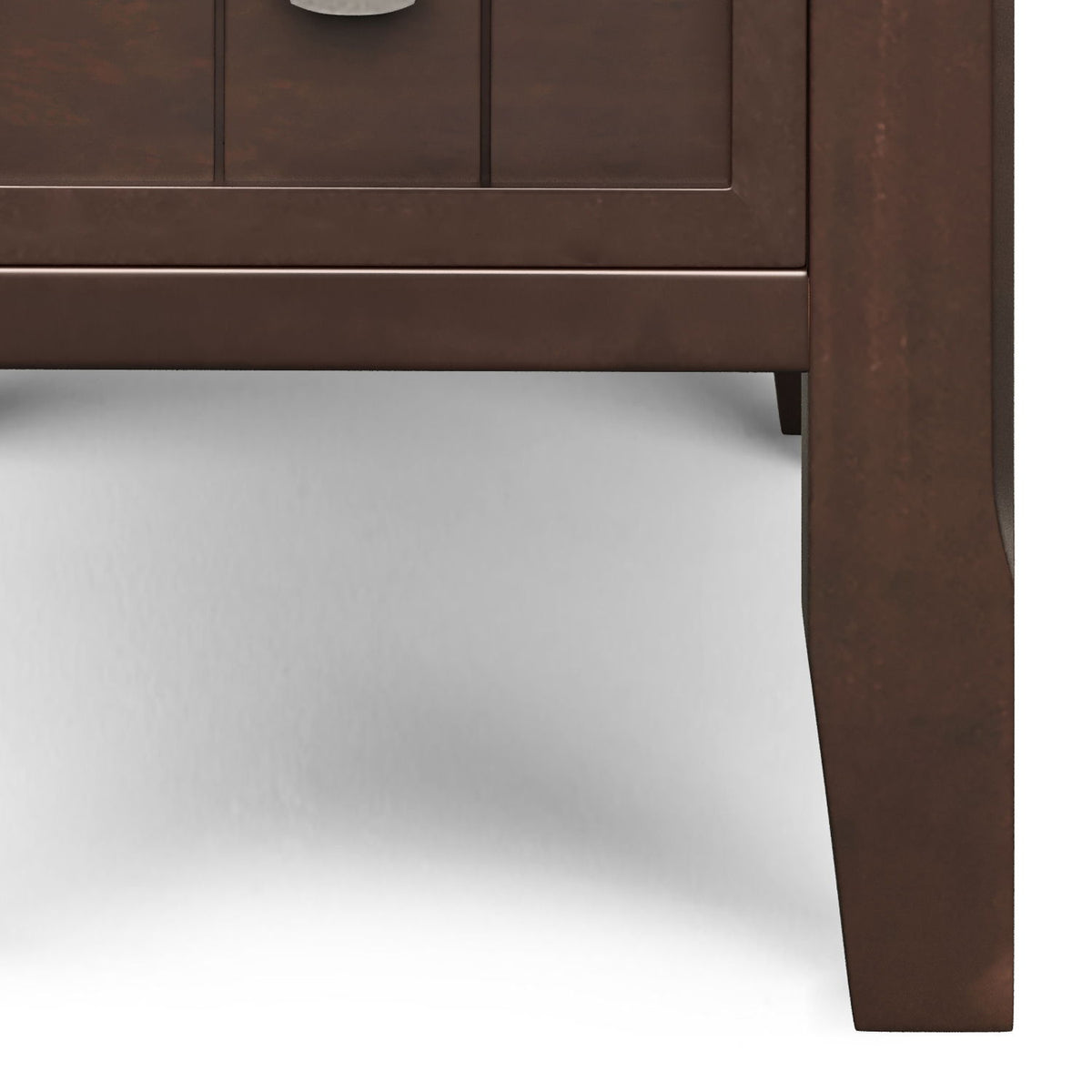 Close-up of the brown side table's drawer front and tapered leg