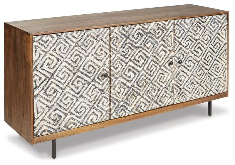 Accent cabinet with three geometric doors, white fabric-look panels with black trim, tapered legs.