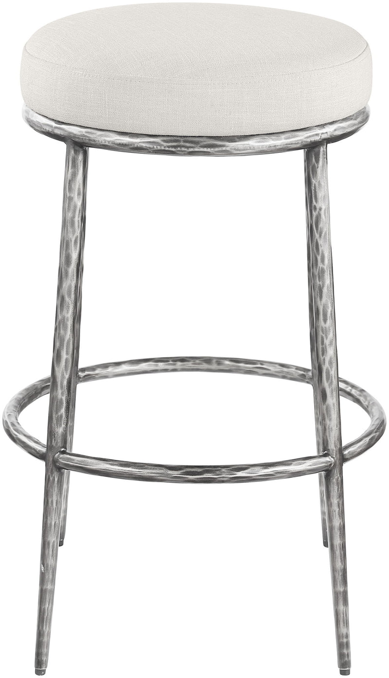 White round upholstered backless bar stool with antique silver metal frame and footrest