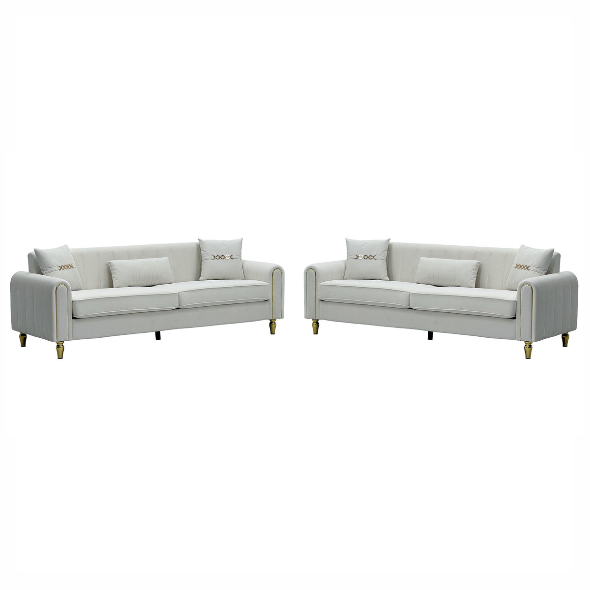 Two light-colored three-seat sofas with ribbed rounded arms and gold-tone legs