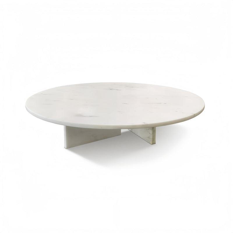 Round white stone coffee table with subtle veining and short split support base