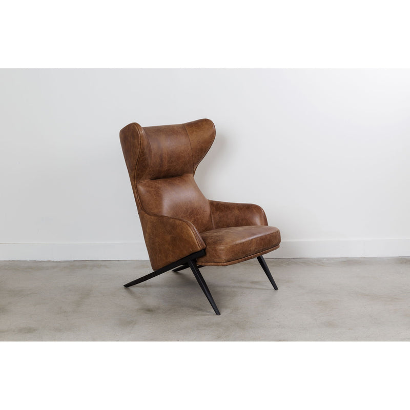 Brown leather accent chair with orange lumbar pillow and black metal legs