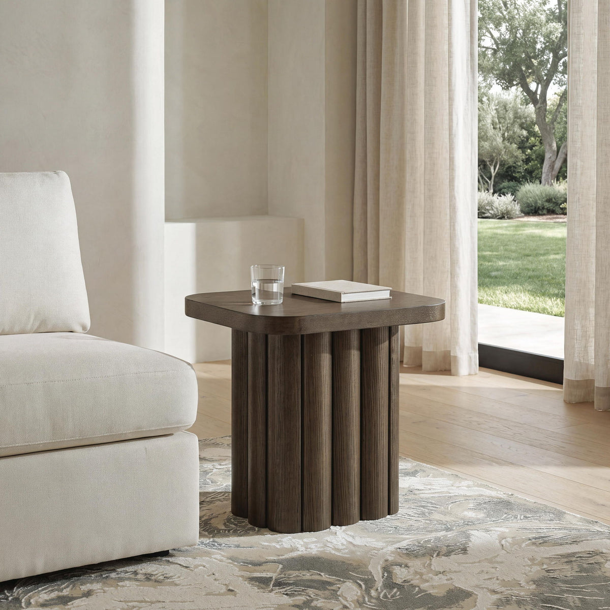 Dark brown rectangular table beside sofa with slatted vertical wood sides
