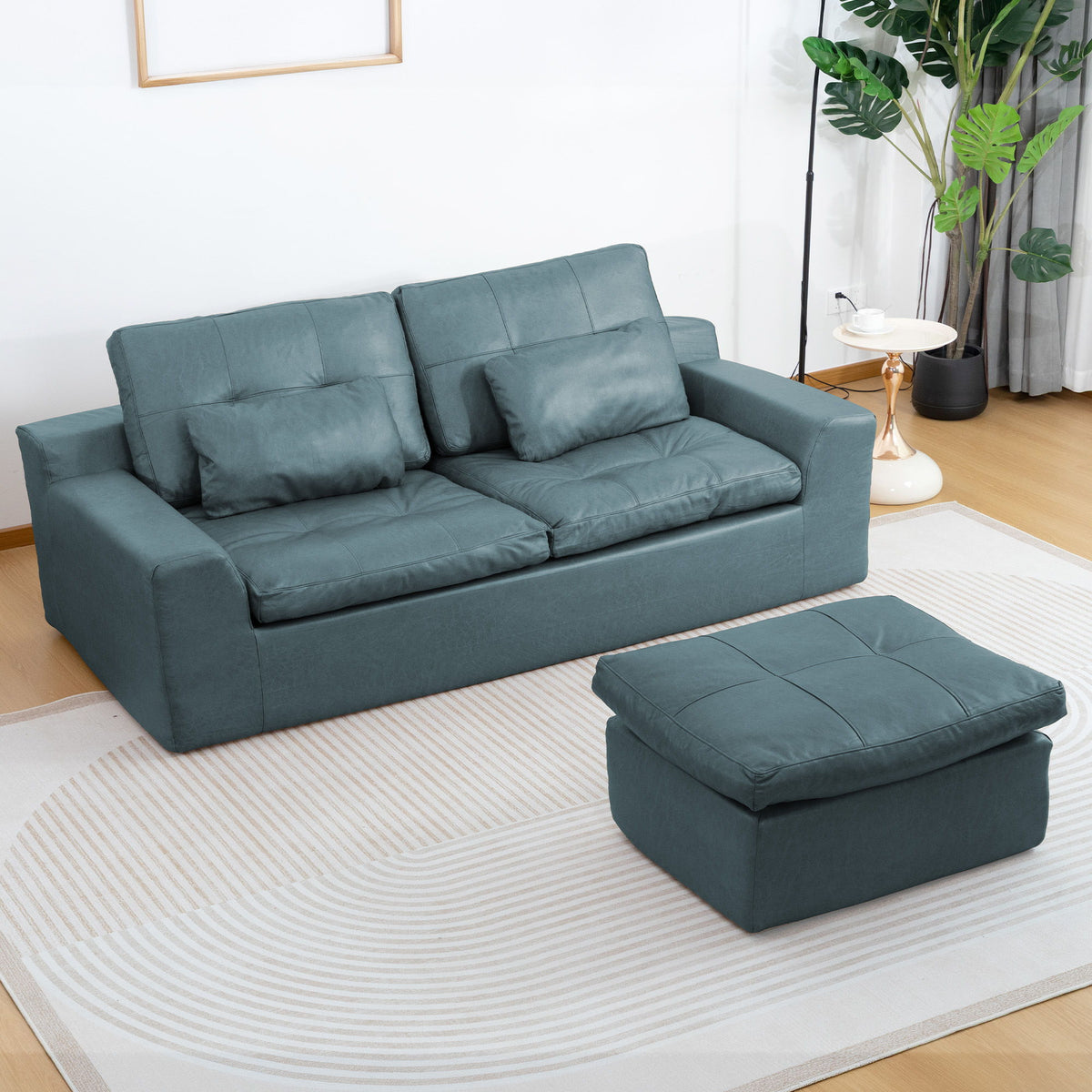 L-shaped 2-seater sofa with movable ottoman, deep teal fabric cushions.