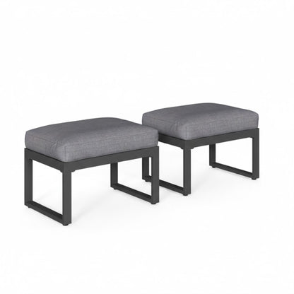 Dark gray patio ottomans set of 2 with thick rectangular cushions and open-frame bases