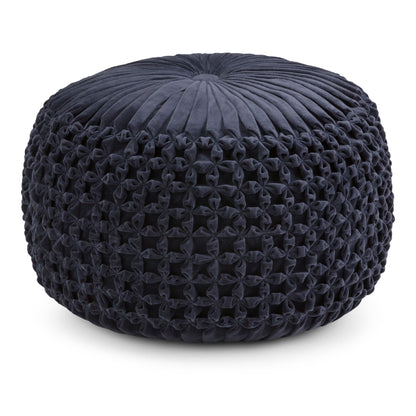 Dark navy round pouf with tufted rosette pattern on textured fabric surface