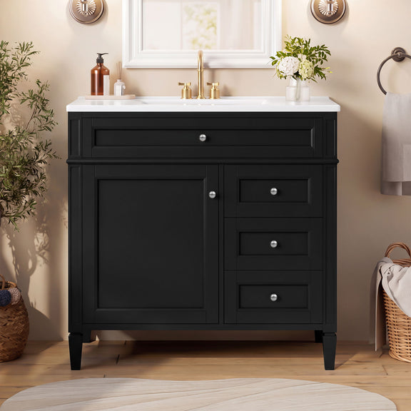 Black vanity with white sink, one cabinet door, three drawers and silver-tone knobs