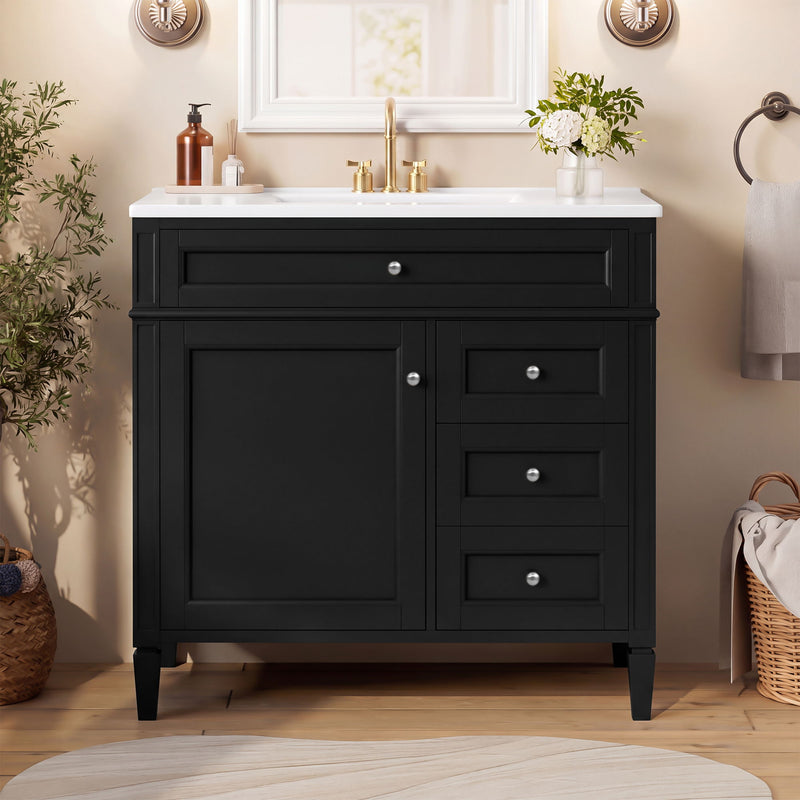 Black vanity with white sink, one cabinet door, three drawers and silver-tone knobs