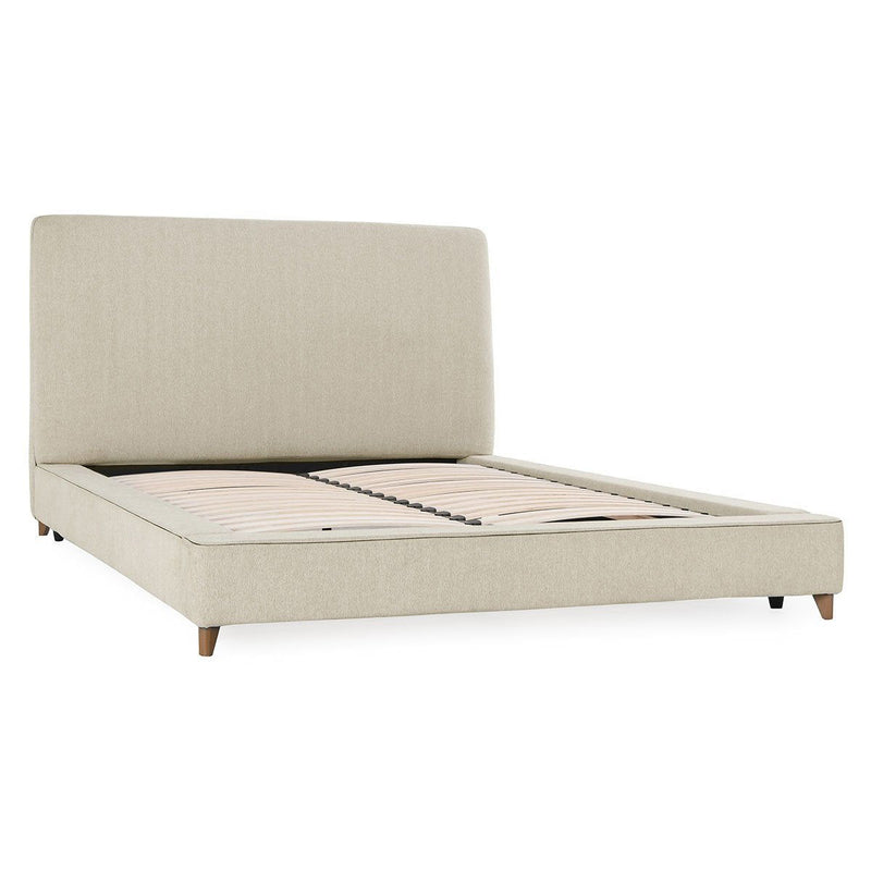 Upholstered oatmeal bed with tall headboard and striped mattress cover