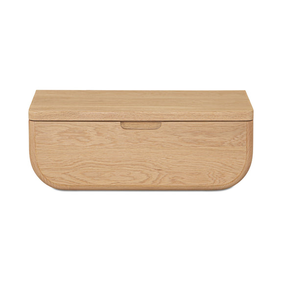 Floating nightstand cabinet with one centered drawer in natural light wood finish.