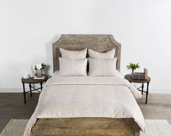 French herringbone duvet in natural beige on top of a neatly made bed
