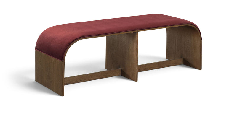 Dark red velvet upholstered bench with curved edges and sturdy wooden base