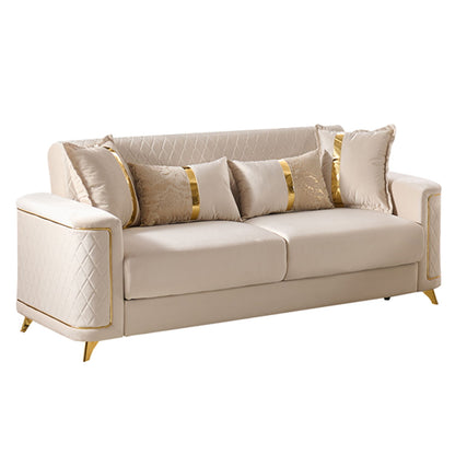 Lisa sofa in light beige upholstery with quilted side panels and gold-striped pillows