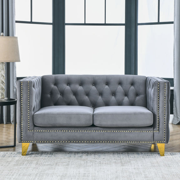 Dark gray button-tufted 3-seat sofa with rolled arms and gold nailhead trim