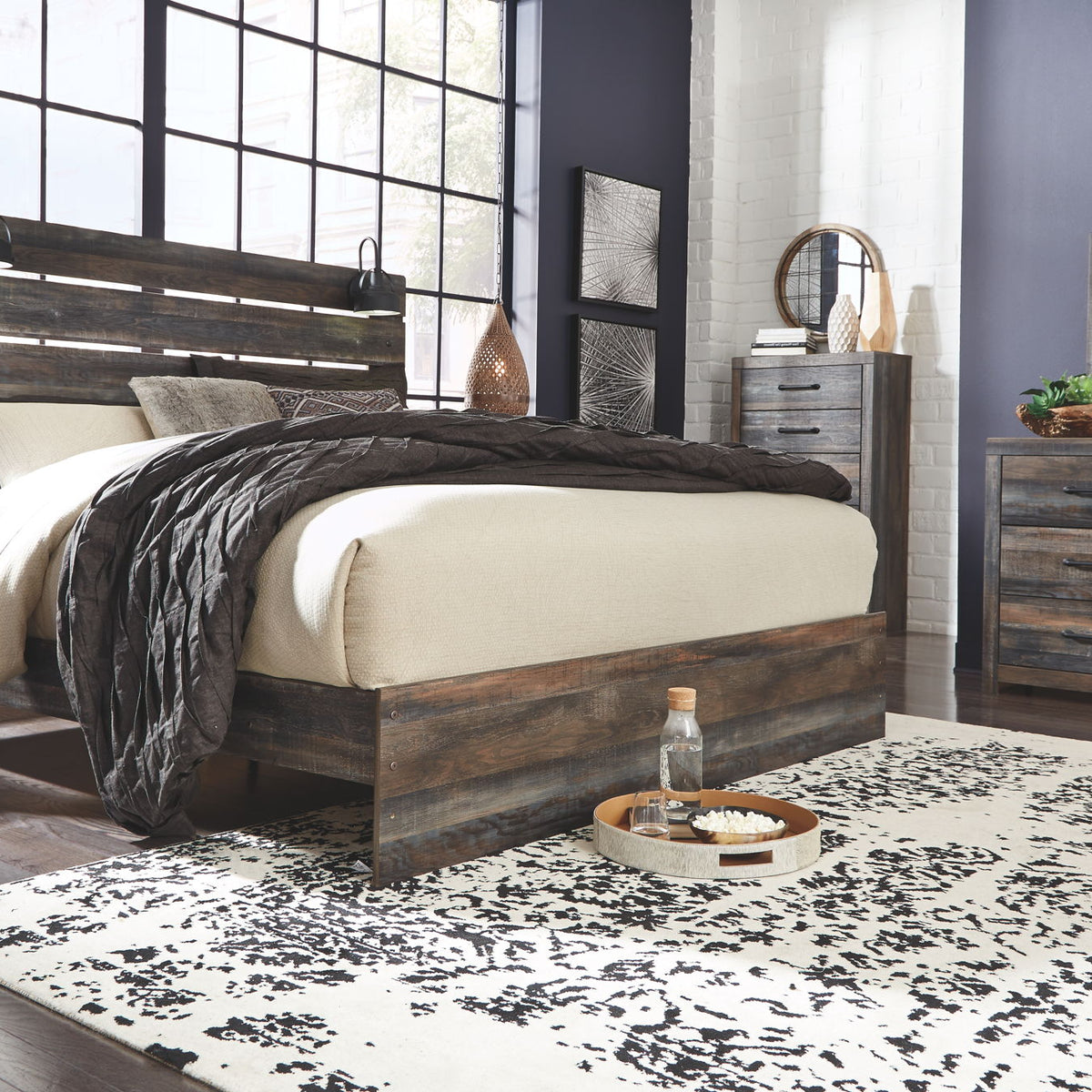 Panel bed with dark wood frame, horizontal slat headboard, and raised footboard