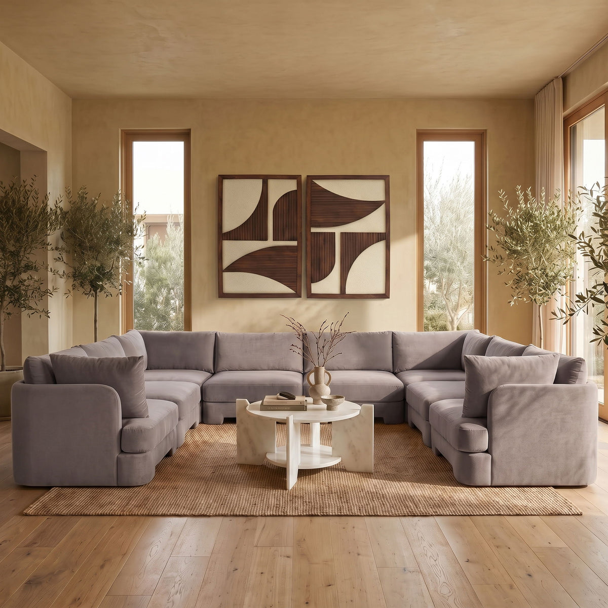 Gray velvet U-shaped sectional sofa with low arms and chaise corner sections