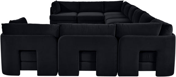 Black velvet sectional sofa with modular seats and padded back cushions
