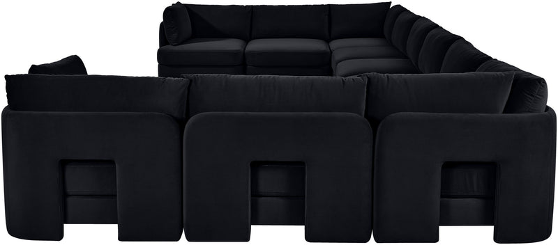Black velvet sectional sofa with modular seats and padded back cushions