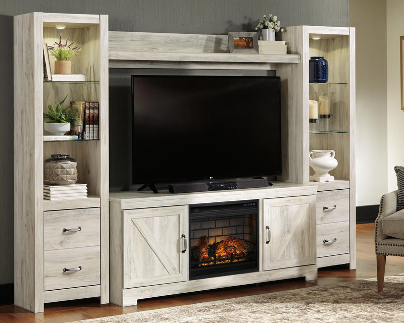 Whitewash entertainment center with TV opening and faux fireplace insert with orange flames