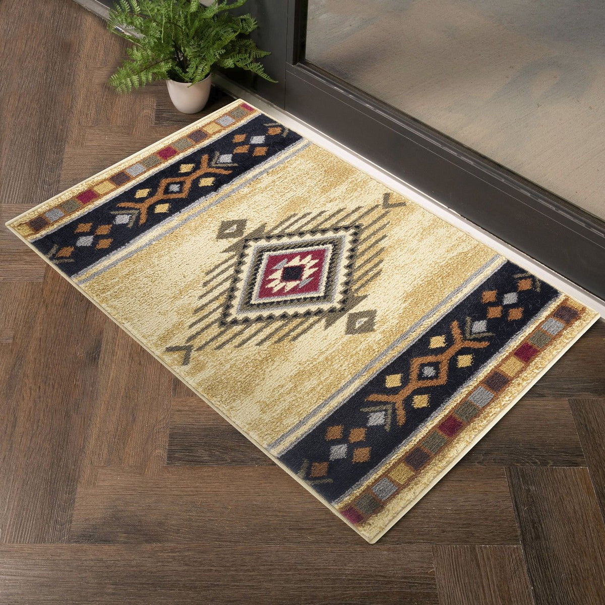 Beige area rug corner view with geometric medallion pattern in navy and burgundy