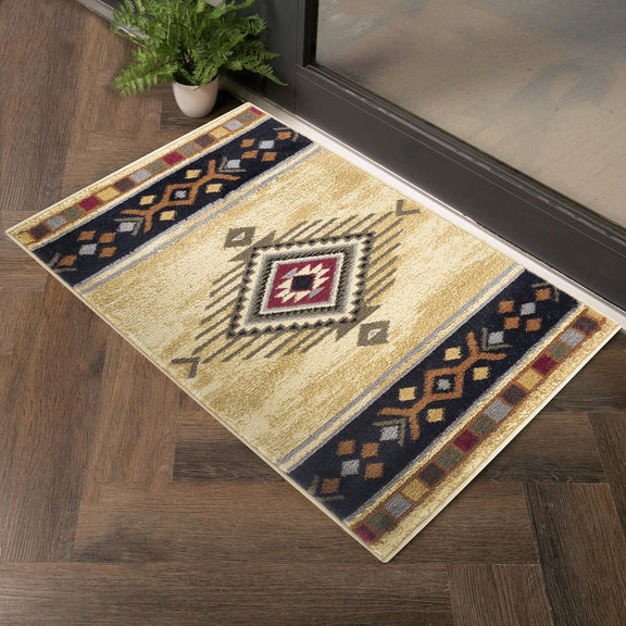 Beige area rug corner view with geometric medallion pattern in navy and burgundy